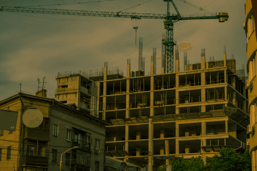 A crane over a modern building under construction in Dnipro, Ukraine.