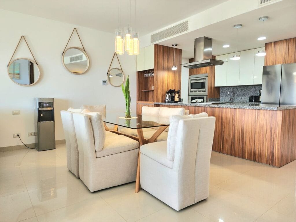 Stylish modern kitchen with wooden accents and cozy dining area for elegant living.